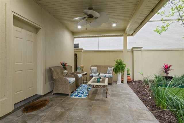 view of patio / terrace with outdoor lounge area, a ceiling fan, and fence