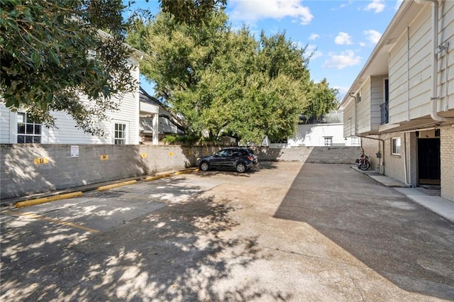 uncovered parking lot with fence