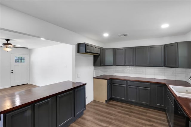 365 Olive Dr, Slidell, LA 70458 - kitchen with visible vents, backsplash, dark wood-type flooring, ceiling fan, and dishwasher