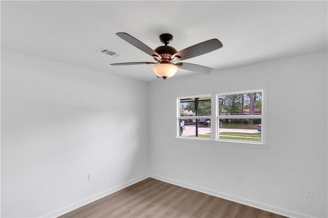 365 Olive Dr, Slidell, LA 70458 - empty room featuring a ceiling fan, wood finished floors, visible vents, and baseboards
