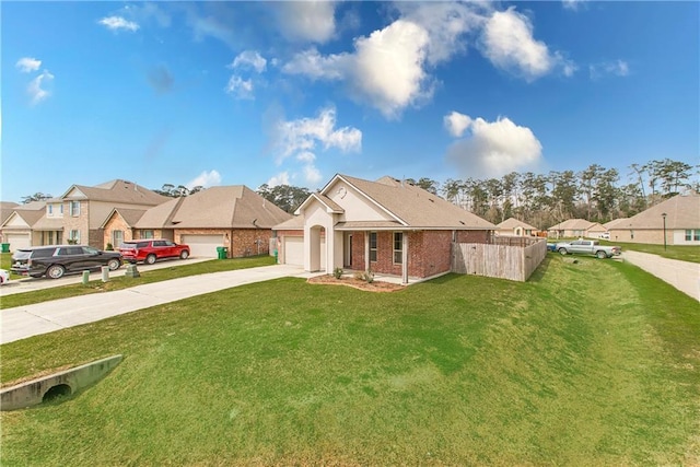 view of front facade featuring fence, a residential view, concrete driveway, a front yard, and an attached garage