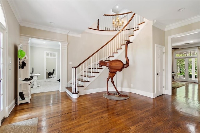 115 Cambridge Dr, Belle Chasse, LA 70037 - foyer featuring ornate columns, stairs, baseboards, ornamental molding, and wood finished floors