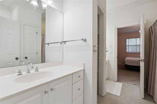 115 Cambridge Dr, Belle Chasse, LA 70037 - bathroom with tile patterned floors, vanity, crown molding, and baseboards
