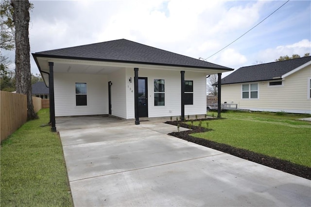 134 Gourgues St, Hahnville, LA 70057 - bungalow featuring a front yard, driveway, a carport, roof with shingles, and fence