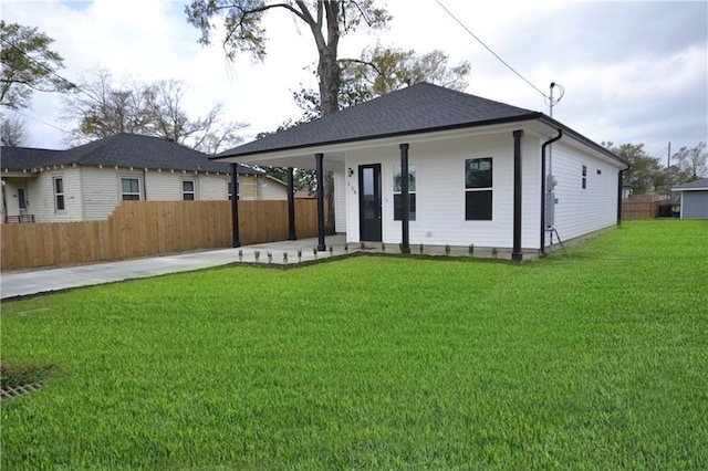 134 Gourgues St, Hahnville, LA 70057 - rear view of property featuring fence, a yard, and concrete driveway