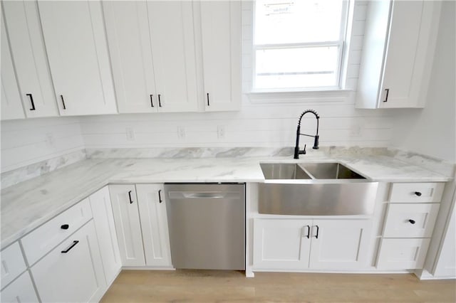 134 Gourgues St, Hahnville, LA 70057 - kitchen featuring stainless steel dishwasher, light stone countertops, a sink, and white cabinets