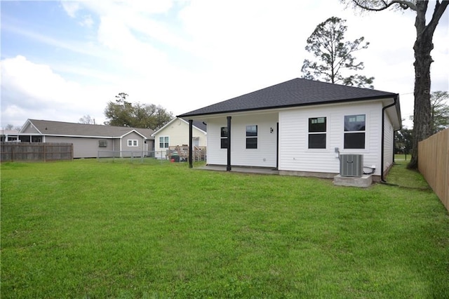 134 Gourgues St, Hahnville, LA 70057 - back of property with a lawn, central AC, and a fenced backyard