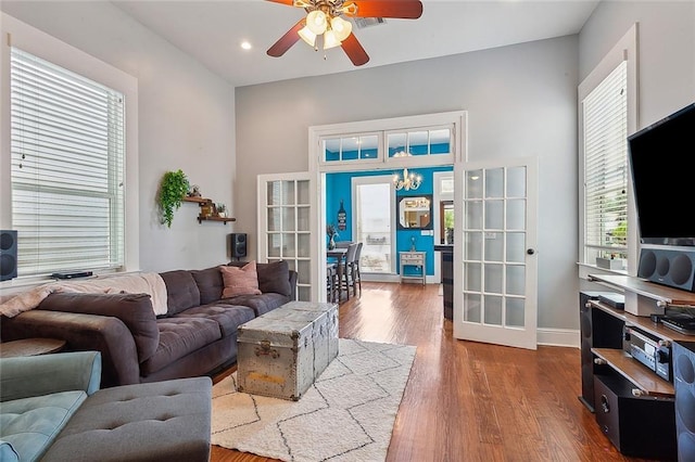 living room with french doors, a ceiling fan, and a wealth of natural light