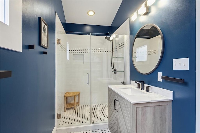 full bathroom featuring a shower stall and vanity