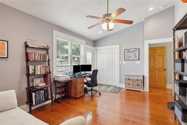 home office featuring a ceiling fan, recessed lighting, wood finished floors, lofted ceiling, and baseboards