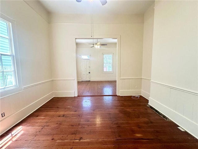 723 Port St, New Orleans, LA 70117 - unfurnished room featuring wood-type flooring and ceiling fan