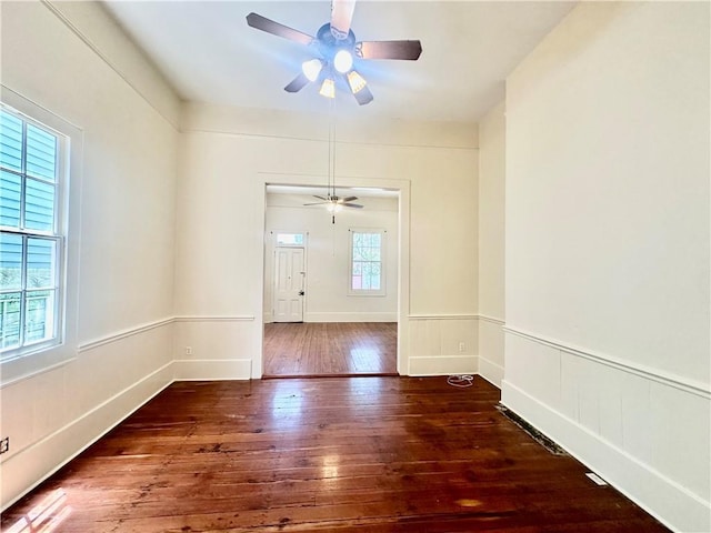 723 Port St, New Orleans, LA 70117 - unfurnished room featuring hardwood / wood-style flooring and a ceiling fan