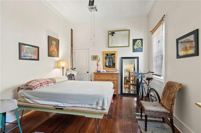 723 Port St, New Orleans, LA 70117 - bedroom featuring dark wood-type flooring and crown molding