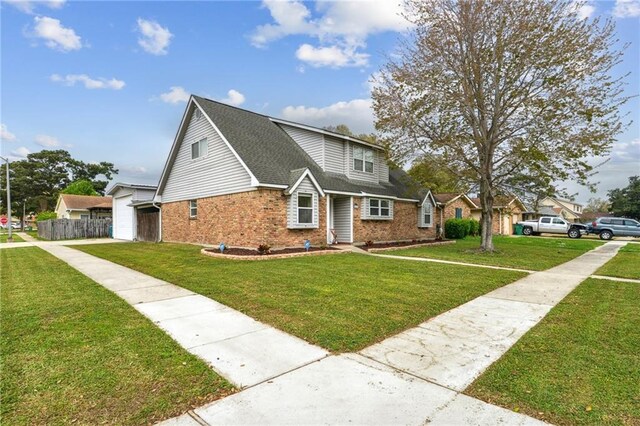 448 Lynnmeade Rd, Gretna, LA 70056 - traditional-style house featuring brick siding, a shingled roof, and driveway