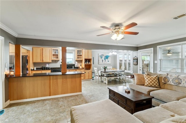 448 Lynnmeade Rd, Gretna, LA 70056 - living room featuring a ceiling fan and crown molding