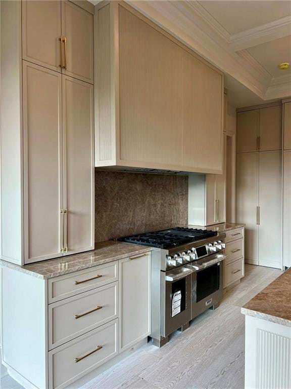 138 Wood Duck Dr, Belle Chasse, LA 70037 - kitchen with stainless steel stove, crown molding, decorative backsplash, light stone counters, and light wood finished floors