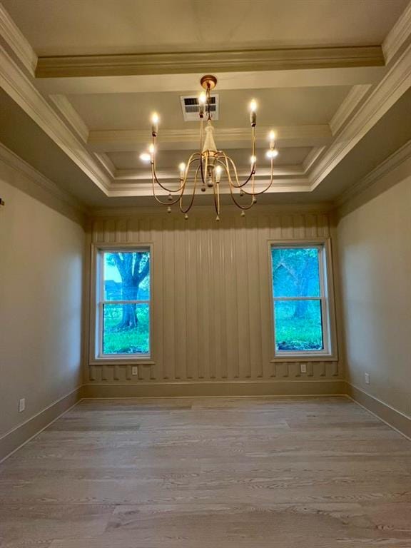 138 Wood Duck Dr, Belle Chasse, LA 70037 - spare room with a chandelier, wood finished floors, ornamental molding, and coffered ceiling