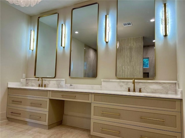138 Wood Duck Dr, Belle Chasse, LA 70037 - bathroom featuring double vanity and baseboards