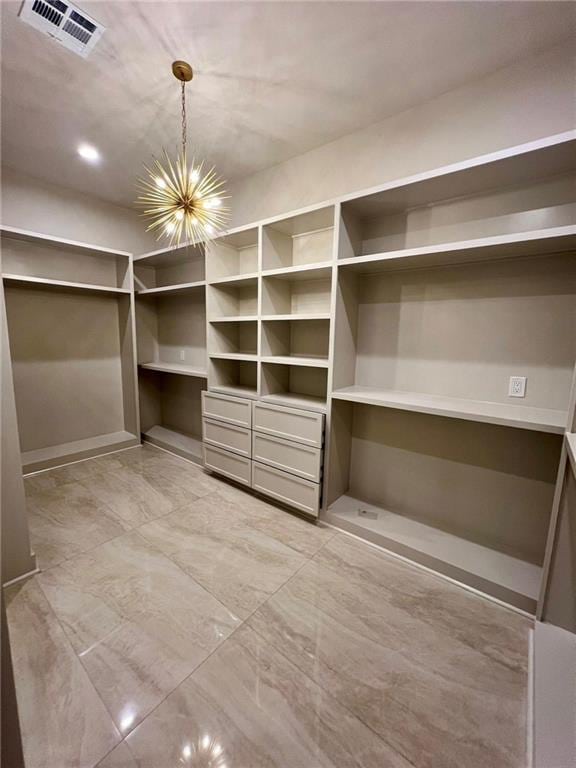 138 Wood Duck Dr, Belle Chasse, LA 70037 - walk in closet with a chandelier