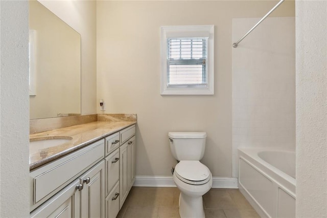 full bath featuring tile patterned flooring, toilet, vanity, and baseboards