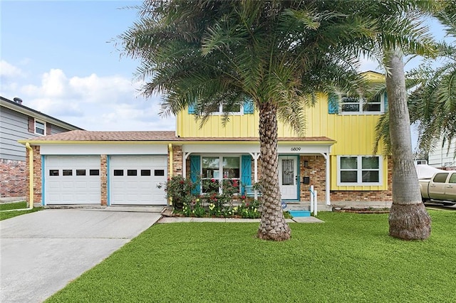 view of front of house featuring a front yard, concrete driveway, brick siding, and a garage