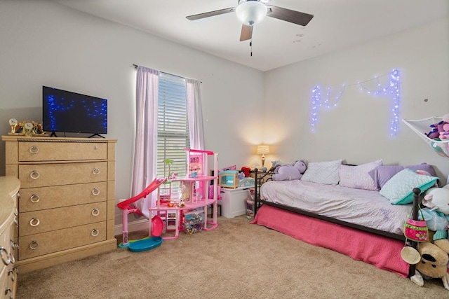 bedroom featuring a ceiling fan and carpet