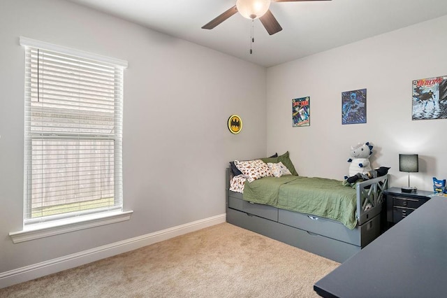 bedroom featuring baseboards, carpet floors, and ceiling fan