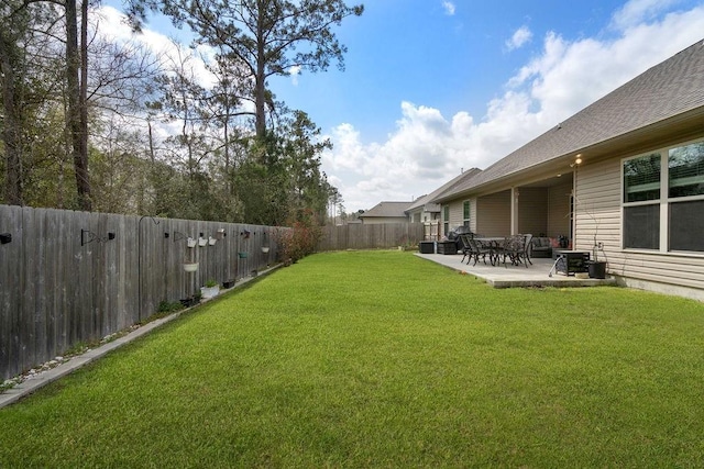 view of yard with a fenced backyard and a patio