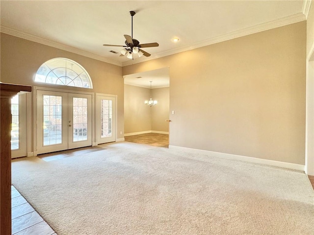 interior space featuring french doors, crown molding, carpet flooring, and ceiling fan with notable chandelier