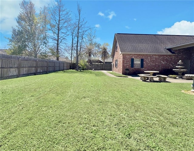 view of yard featuring a fenced backyard