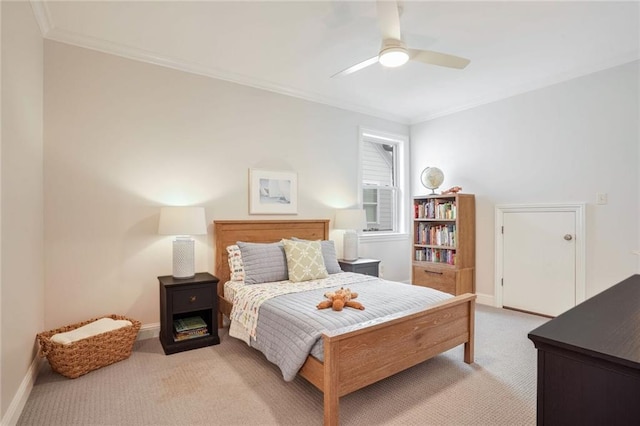 bedroom featuring light carpet, crown molding, and baseboards