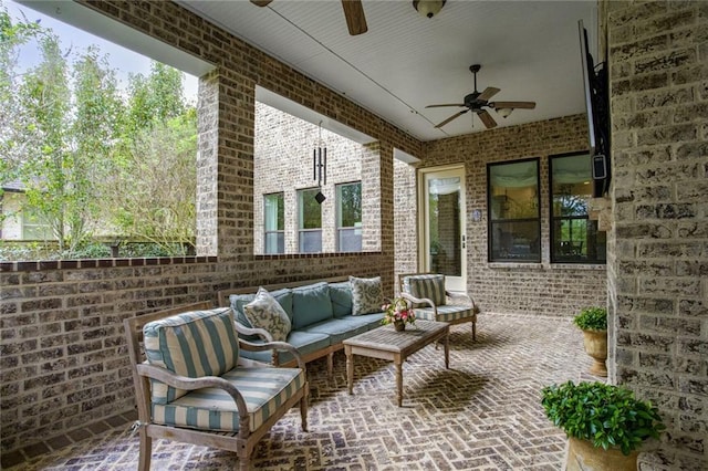 view of patio featuring an outdoor hangout area and a ceiling fan