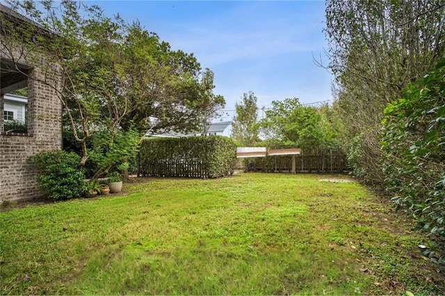 view of yard featuring fence