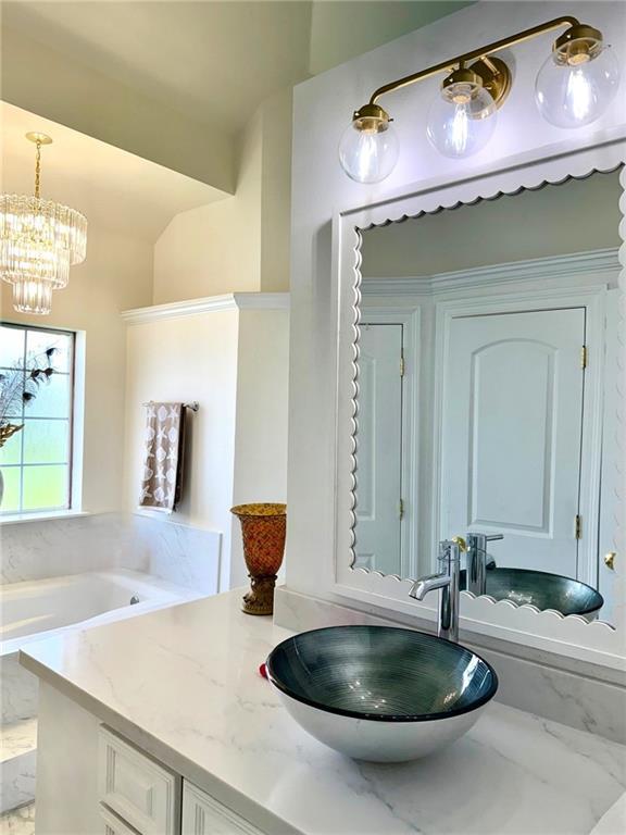 5227 Shady Park Dr, Marrero, LA 70072 - bathroom with vanity, marble finish flooring, and a bathtub