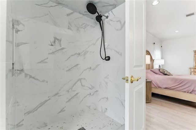 5227 Shady Park Dr, Marrero, LA 70072 - full bath featuring connected bathroom, a marble finish shower, recessed lighting, and wood finished floors