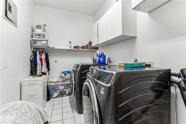 5227 Shady Park Dr, Marrero, LA 70072 - washroom featuring separate washer and dryer, cabinet space, and light tile patterned floors