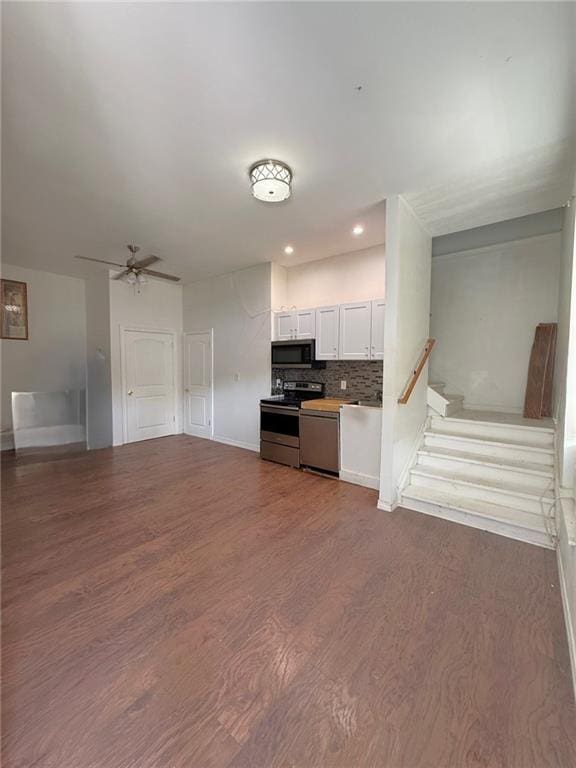 5227 Shady Park Dr, Marrero, LA 70072 - unfurnished living room featuring wood finished floors, ceiling fan, stairway, and recessed lighting