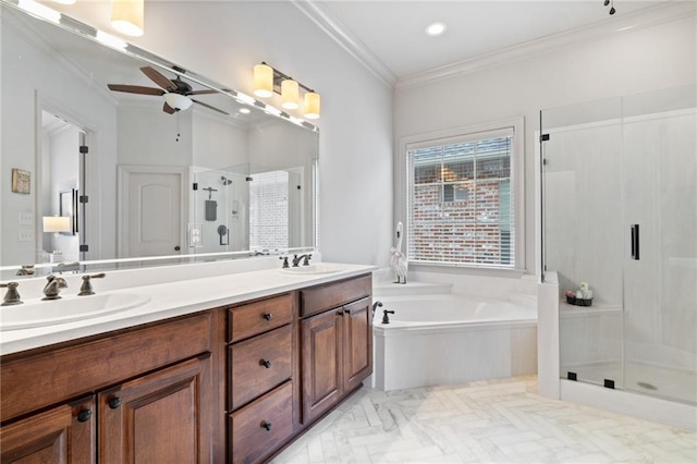 full bathroom featuring ornamental molding, a sink, a shower stall, double vanity, and a bath