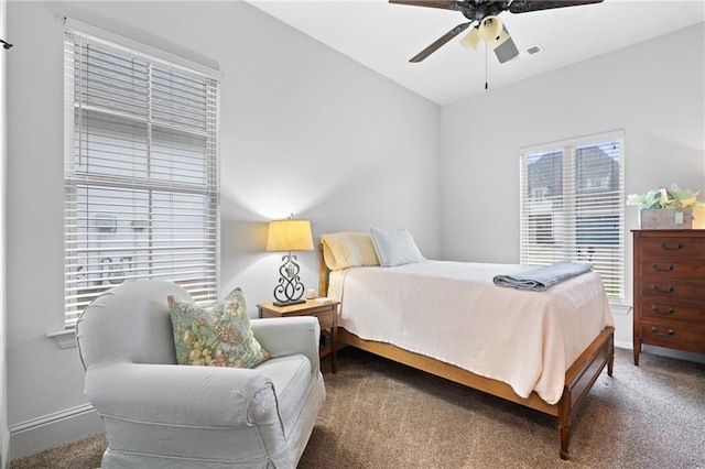 carpeted bedroom featuring visible vents, baseboards, and ceiling fan