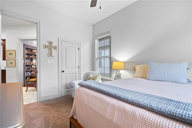 bedroom with baseboards, a ceiling fan, and carpet flooring