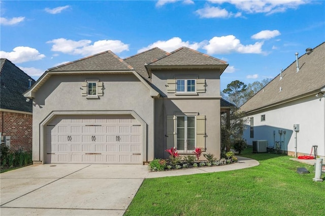 view of front of home with stucco siding, cooling unit, concrete driveway, and a front lawn