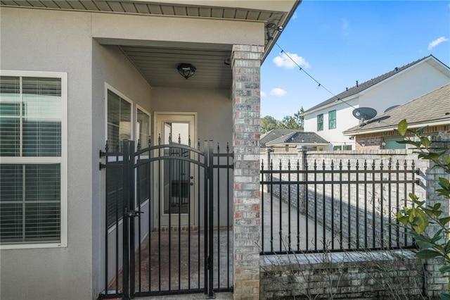 view of gate featuring fence