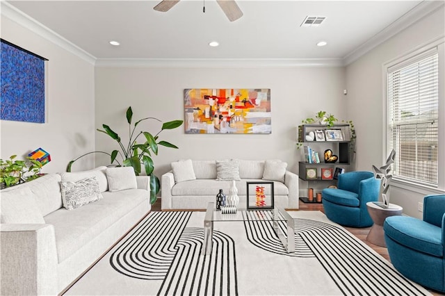 living area with recessed lighting, visible vents, a ceiling fan, and crown molding