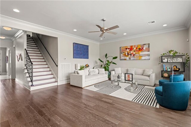 living area featuring visible vents, wood finished floors, stairway, crown molding, and ceiling fan