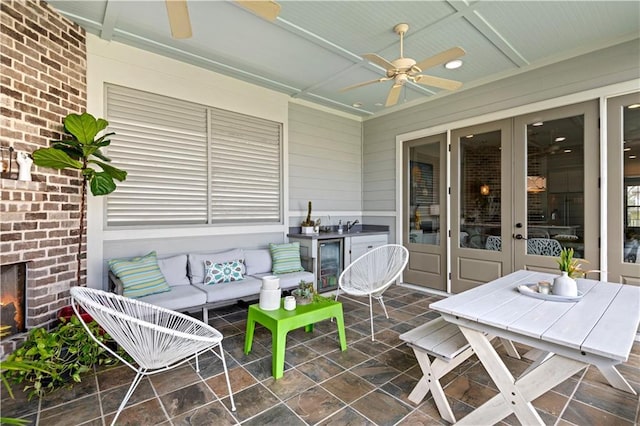 view of patio / terrace with an outdoor hangout area, wine cooler, and ceiling fan