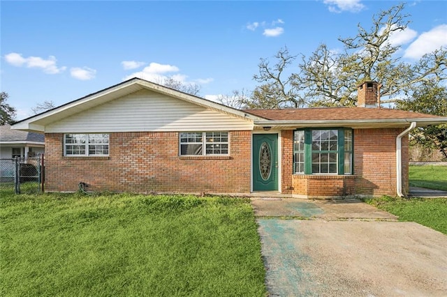 105 Palm Springs Dr, Slidell, LA 70458 - ranch-style home with a front lawn, fence, brick siding, and a chimney