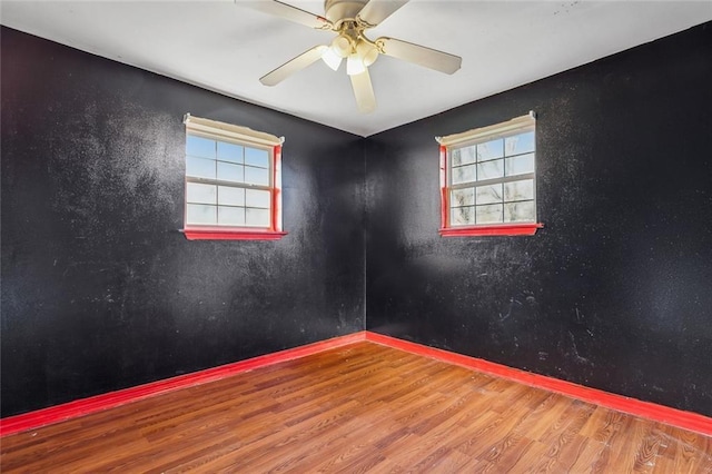 105 Palm Springs Dr, Slidell, LA 70458 - empty room with plenty of natural light, wood finished floors, and ceiling fan