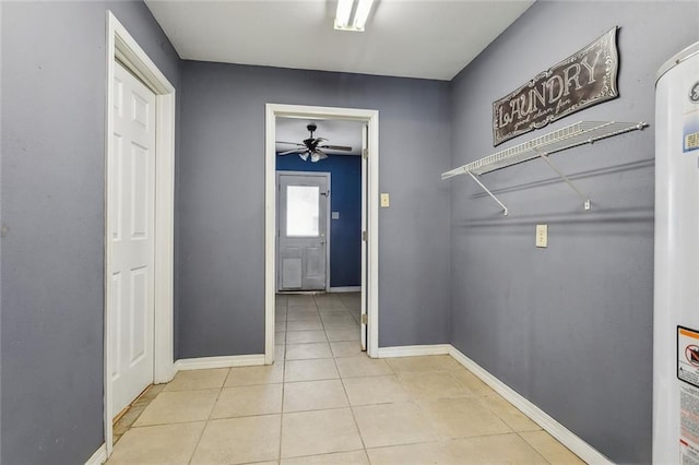 105 Palm Springs Dr, Slidell, LA 70458 - clothes washing area with tile patterned floors, baseboards, and ceiling fan