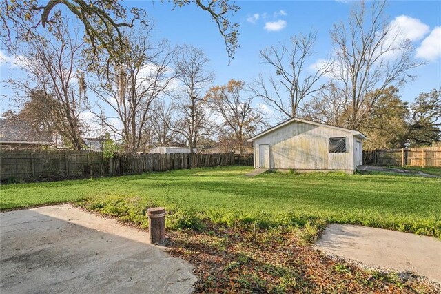 105 Palm Springs Dr, Slidell, LA 70458 - view of yard with a fenced backyard, an outdoor structure, and a patio area