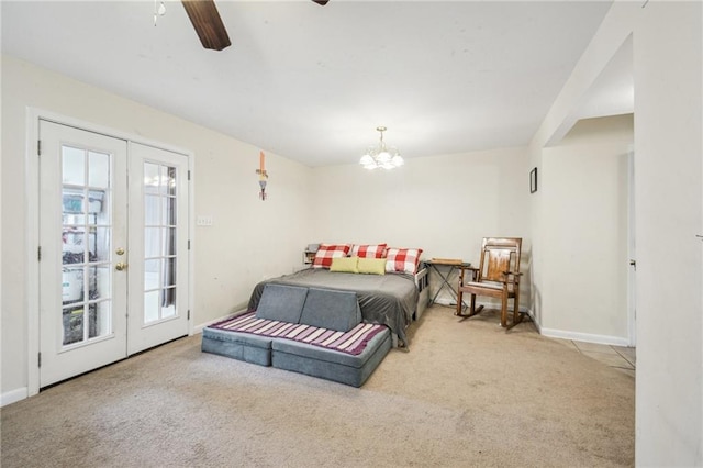 bedroom with carpet, ceiling fan with notable chandelier, and baseboards